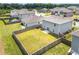This aerial view highlights a fully fenced-in backyard with room for outdoor activities at 3660 Cattle Field Xing, Loganville, GA 30052