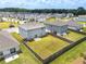 This aerial view displays a grassy backyard and a home exterior with sliding glass doors at 3660 Cattle Field Xing, Loganville, GA 30052