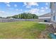 Expansive grassy backyard with privacy fence, perfect for outdoor activities and entertaining at 3660 Cattle Field Xing, Loganville, GA 30052