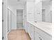Bright bathroom with double vanity, walk-in shower, and walk-in closet at 3660 Cattle Field Xing, Loganville, GA 30052