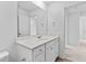 Bathroom featuring vanity with a white sink, neutral colored walls, and wood look flooring at 3660 Cattle Field Xing, Loganville, GA 30052