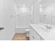 Bathroom featuring tub, shower, wood look floors, and a vanity with a white sink at 3660 Cattle Field Xing, Loganville, GA 30052