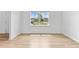 Bright bedroom with natural light, white walls, and lovely hardwood floors at 3660 Cattle Field Xing, Loganville, GA 30052