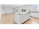 Open kitchen layout featuring an island and granite countertops with stainless steel appliances at 3660 Cattle Field Xing, Loganville, GA 30052