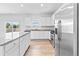 Kitchen view featuring granite countertops, stainless steel appliances, and ample storage at 3660 Cattle Field Xing, Loganville, GA 30052