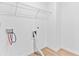 Well-lit laundry room showcasing washer and dryer hookups, with white walls and wood-look flooring at 3660 Cattle Field Xing, Loganville, GA 30052