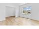 A bright and airy living room with hardwood floors and a large window at 3660 Cattle Field Xing, Loganville, GA 30052