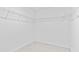 Walk-in closet providing ample storage space with installed wire shelving and neutral carpeting at 3660 Cattle Field Xing, Loganville, GA 30052