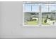 Bedroom view through a large window showcasing a suburban neighborhood at 3660 Cattle Field Xing, Loganville, GA 30052