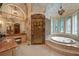Bathroom with granite counters, jacuzzi tub, and glass shower at 720 Heards Ferry Rd, Sandy Springs, GA 30328