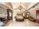 The primary bedroom showcases luxurious textures, a fireplace, and a tray ceiling adding depth and elegance to the space at 720 Heards Ferry Rd, Sandy Springs, GA 30328
