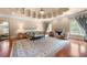 Bright bedroom with a unique coffered ceiling, hardwood floors, and a decorative fireplace at 720 Heards Ferry Rd, Sandy Springs, GA 30328