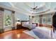 Spacious bedroom with hardwood floors, ceiling fan, and natural light at 720 Heards Ferry Rd, Sandy Springs, GA 30328