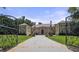 Stately home with manicured front lawn, grand entrance, and wrought iron gates at 720 Heards Ferry Rd, Sandy Springs, GA 30328