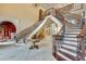 An extravagant home foyer with a dual winding staircase and chandelier at 720 Heards Ferry Rd, Sandy Springs, GA 30328