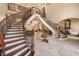 Grand foyer with a sweeping staircase and exquisite wrought iron detailing at 720 Heards Ferry Rd, Sandy Springs, GA 30328