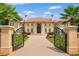 Stately Mediterranean home featuring a grand entrance and manicured grounds at 720 Heards Ferry Rd, Sandy Springs, GA 30328