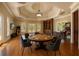 Entertain in this game room with a round table, arcade games, pinball, and custom ceiling lighting at 720 Heards Ferry Rd, Sandy Springs, GA 30328