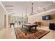 Game room with pool table, foosball table, marble floors, large windows, and flat screen TV at 720 Heards Ferry Rd, Sandy Springs, GA 30328