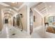 Hallway with barrel ceiling that leads to a game room and a formal dining area at 720 Heards Ferry Rd, Sandy Springs, GA 30328