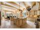 An expansive kitchen with double islands, stone countertops, and high-end appliances for cooking experience at 720 Heards Ferry Rd, Sandy Springs, GA 30328