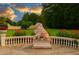 Beautifully landscaped grounds with a stately lion statue and manicured greenery at 720 Heards Ferry Rd, Sandy Springs, GA 30328