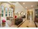 Large living room showcasing tall windows, fireplace, and an elegant, open floor plan at 720 Heards Ferry Rd, Sandy Springs, GA 30328