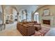 Comfortable living room featuring a fireplace, arched doorways, and ample seating at 720 Heards Ferry Rd, Sandy Springs, GA 30328