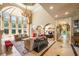 Spacious living room with soaring ceilings, large windows, and elegant columns at 720 Heards Ferry Rd, Sandy Springs, GA 30328