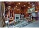 Richly appointed office with wood paneling, fireplace, and custom built-in shelving at 720 Heards Ferry Rd, Sandy Springs, GA 30328