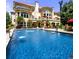 Spectacular pool with fountains, red umbrellas, and a spacious patio and a covered patio at 720 Heards Ferry Rd, Sandy Springs, GA 30328