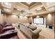 The theater room has large leather couches, a projector, and a large screen for a great viewing experience at 720 Heards Ferry Rd, Sandy Springs, GA 30328