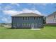 Two-story home with spacious backyard and dark blue siding at 1816 Kingsmere Run Dr, Loganville, GA 30052
