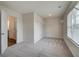 Bright bedroom with a walk-in closet and neutral carpet at 1816 Kingsmere Run Dr, Loganville, GA 30052