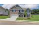 Spacious two-story brick house with a lush green lawn, offering a modern and comfortable living space at 1816 Kingsmere Run Dr, Loganville, GA 30052