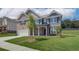 Modern two-story brick home, accented by professionally landscaped grounds, combining elegance and comfort at 1816 Kingsmere Run Dr, Loganville, GA 30052