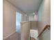 Second story hallway view of stairs and additional room at 1816 Kingsmere Run Dr, Loganville, GA 30052