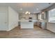 Kitchen features grey cabinets, granite countertops, stainless steel appliances, and an island offering modern style and functionality at 1816 Kingsmere Run Dr, Loganville, GA 30052
