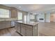 Kitchen with granite countertops, grey cabinets, and an open layout concept at 1816 Kingsmere Run Dr, Loganville, GA 30052