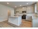 Kitchen features granite countertops, stainless steel appliances, and an island, blending functionality with style at 1816 Kingsmere Run Dr, Loganville, GA 30052