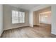 Bright living room area with new wood-look floors offering a spacious open concept design at 1816 Kingsmere Run Dr, Loganville, GA 30052