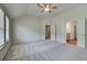 Bright primary bedroom boasts vaulted ceilings and ensuite bathroom access at 1816 Kingsmere Run Dr, Loganville, GA 30052