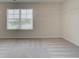 Walk-in closet with a window for natural light and shelving for organization at 1816 Kingsmere Run Dr, Loganville, GA 30052