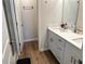 This bathroom showcases a quartz countertop with a double-sink vanity and tile flooring at 2670 Greenbelt Rd, Snellville, GA 30078