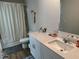 Bathroom featuring modern vanity with cultured marble countertop and updated fixtures with a shower at 2670 Greenbelt Rd, Snellville, GA 30078