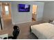 Bedroom features a wall-mounted TV and ensuite bathroom at 2670 Greenbelt Rd, Snellville, GA 30078