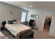 Bright bedroom featuring a comfortable bed, desk area, and closet at 2670 Greenbelt Rd, Snellville, GA 30078