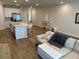 Open floorplan with island seating at the kitchen and a comfortable living room at 2670 Greenbelt Rd, Snellville, GA 30078