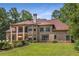 Expansive backyard featuring a multi-story brick home with lush lawn at 450 Dorset Sw Way, Smyrna, GA 30082