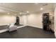 Large basement with mirrored wall, neutral paint, dark flooring, and equipment for internet and sound at 450 Dorset Sw Way, Smyrna, GA 30082